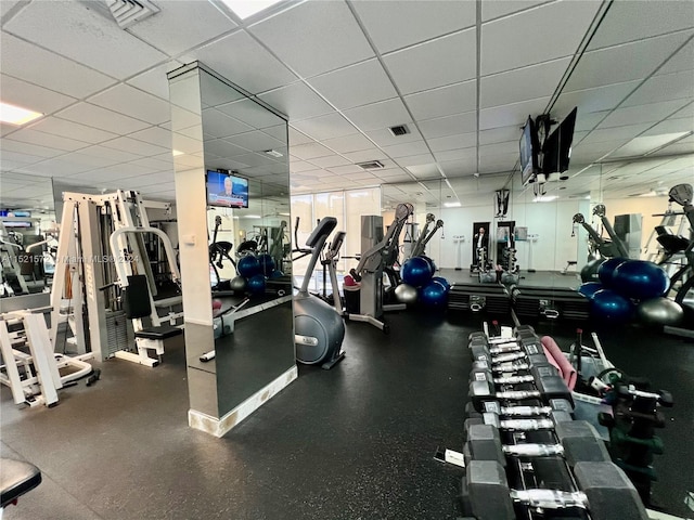 exercise room with a drop ceiling