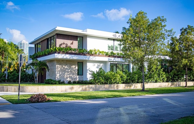 exterior space featuring a front lawn