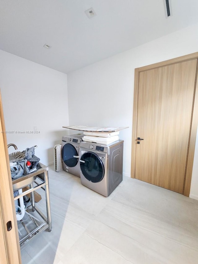 laundry room with washer and dryer