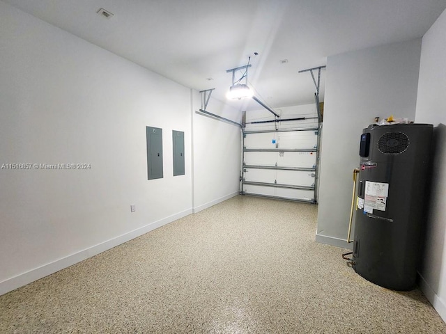 garage featuring water heater and electric panel