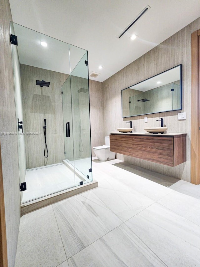 bathroom featuring vanity and an enclosed shower