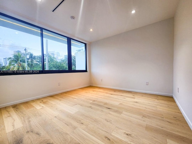 unfurnished room featuring light hardwood / wood-style floors