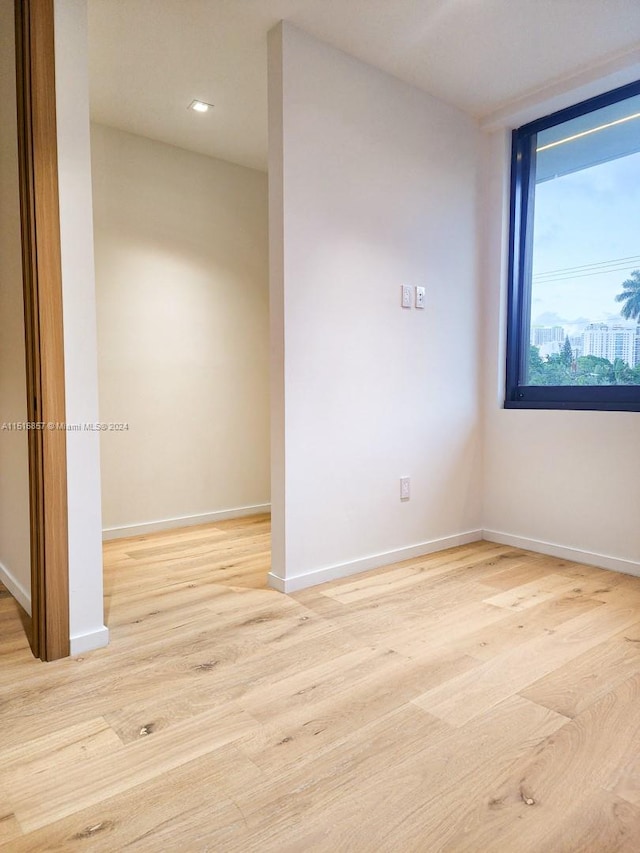 unfurnished room featuring light hardwood / wood-style flooring