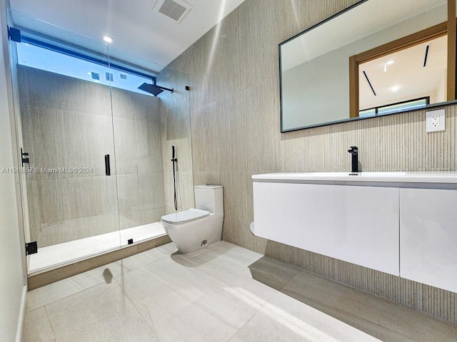 bathroom featuring tile patterned flooring, an enclosed shower, a healthy amount of sunlight, vanity, and toilet