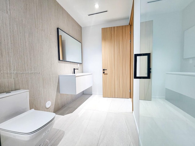 bathroom featuring vanity, toilet, and tile patterned floors