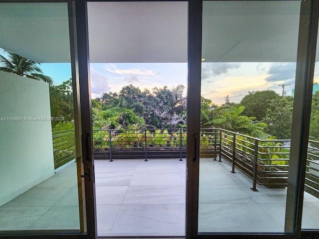 view of balcony at dusk