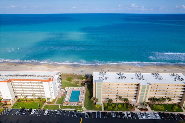 aerial view featuring a water view and a view of the beach