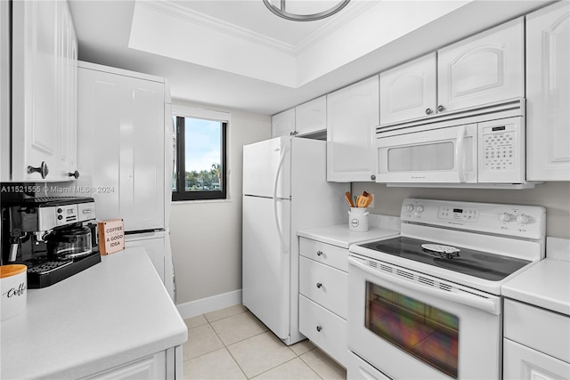 kitchen featuring white cabinetry, light tile flooring, white appliances, a raised ceiling, and crown molding