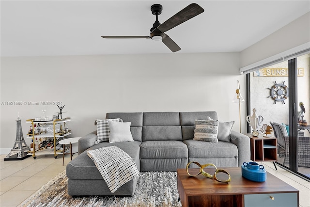 living room with light tile floors and ceiling fan