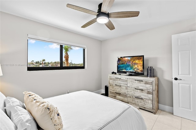 bedroom with light tile floors and ceiling fan