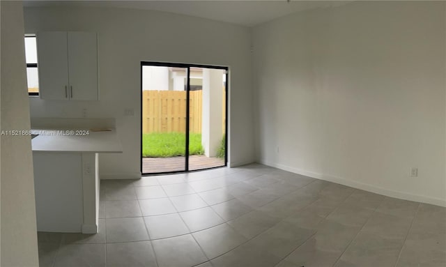 empty room featuring light tile floors