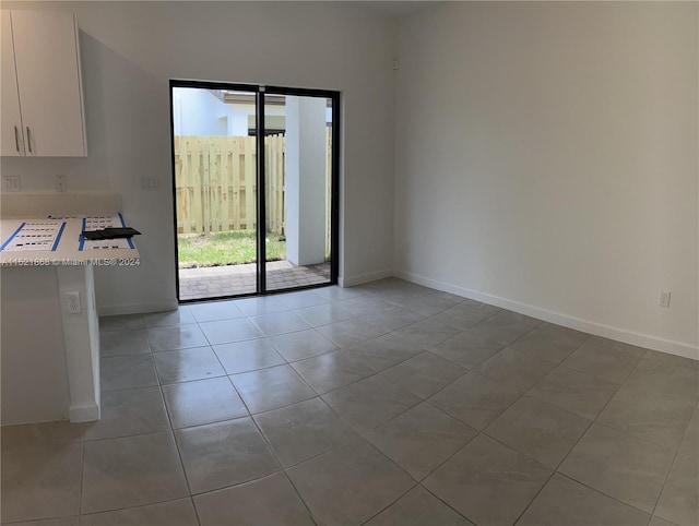 empty room featuring tile flooring