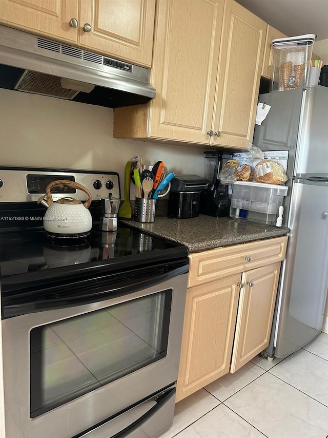 kitchen with light brown cabinets, light tile floors, and appliances with stainless steel finishes