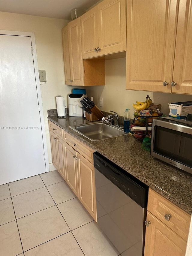 kitchen with light brown cabinets, appliances with stainless steel finishes, light tile floors, and sink