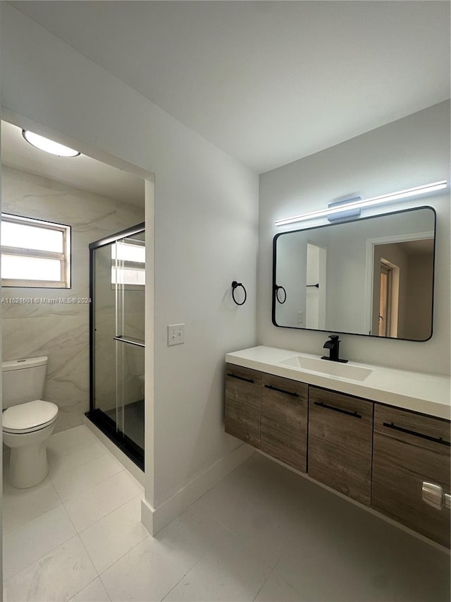bathroom featuring toilet, tile walls, tile patterned floors, an enclosed shower, and vanity
