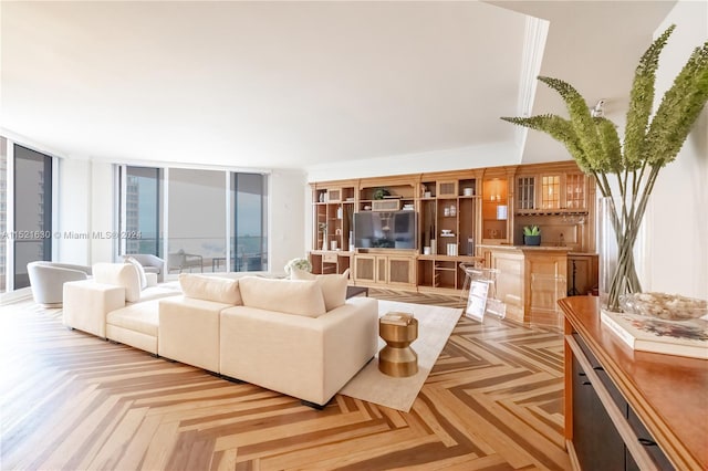 living room with light parquet flooring and floor to ceiling windows