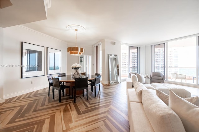 dining space featuring an inviting chandelier, parquet flooring, and crown molding