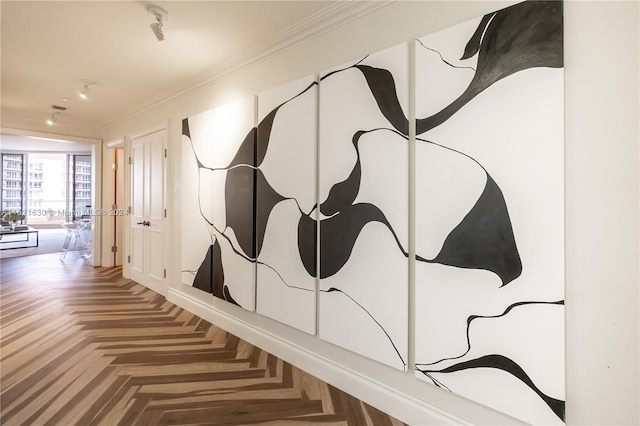 hallway with parquet flooring and crown molding