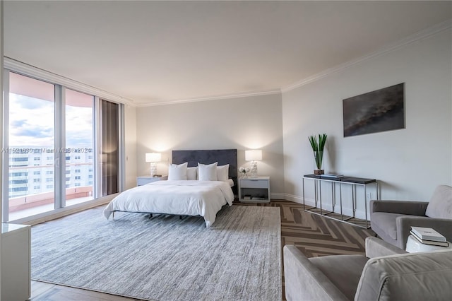 bedroom featuring parquet flooring, access to exterior, and crown molding