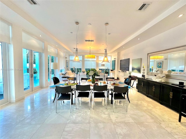 dining space featuring plenty of natural light, french doors, and light tile floors