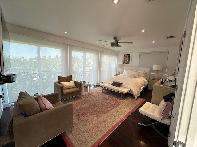 bedroom featuring dark hardwood / wood-style flooring and ceiling fan