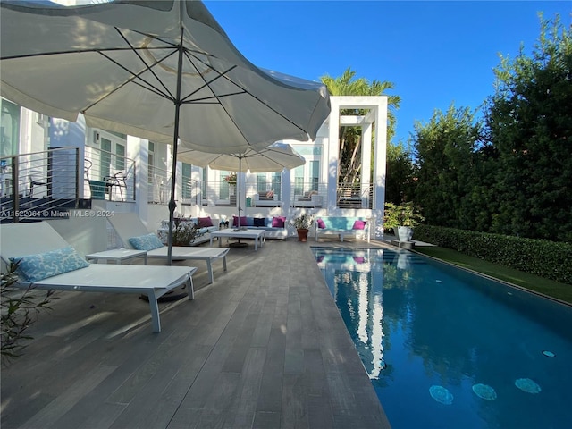 view of swimming pool featuring outdoor lounge area and a patio