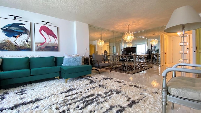 living room with a textured ceiling and a chandelier