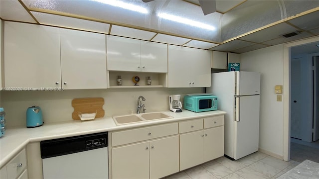 kitchen featuring sink, white appliances, and white cabinets