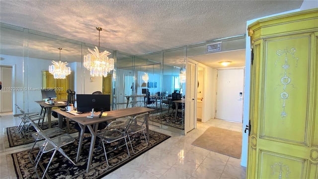 dining area featuring a textured ceiling and an inviting chandelier