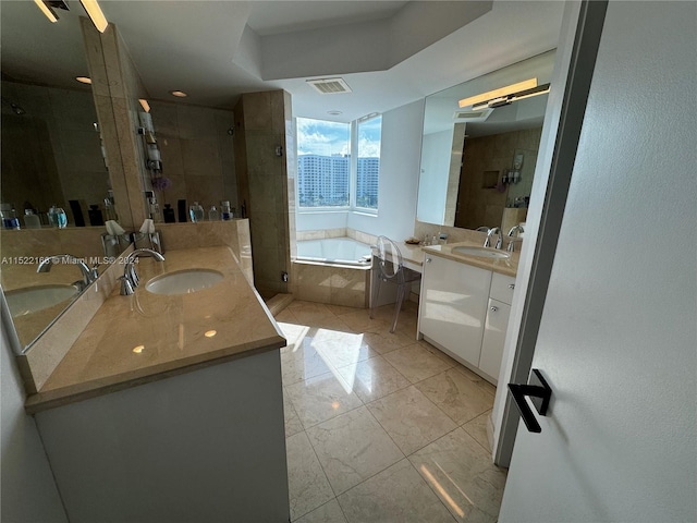 bathroom with oversized vanity, separate shower and tub, and tile flooring