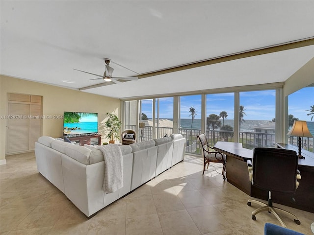 tiled living room featuring ceiling fan