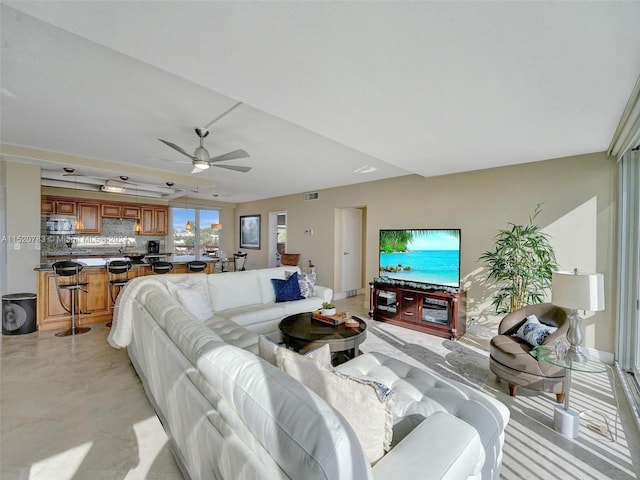 living room with ceiling fan