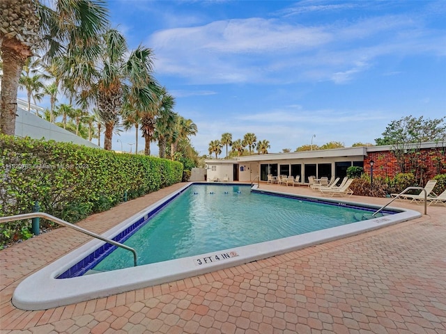 view of swimming pool featuring a patio area