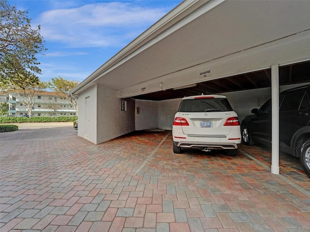 exterior space with a carport