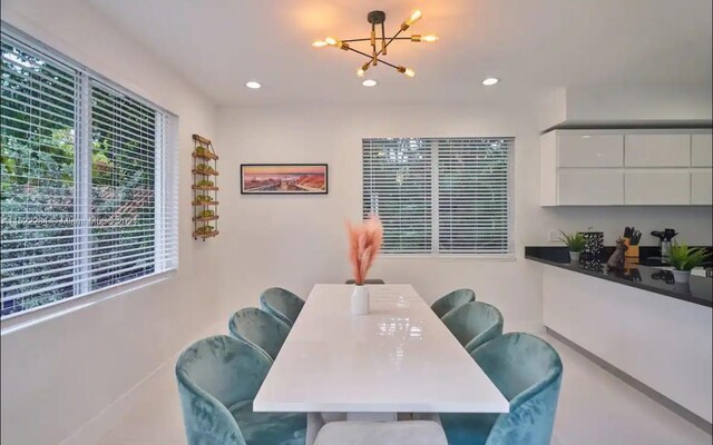 dining space featuring a notable chandelier