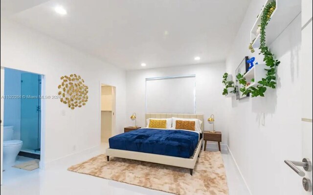 bedroom featuring recessed lighting, connected bathroom, and baseboards