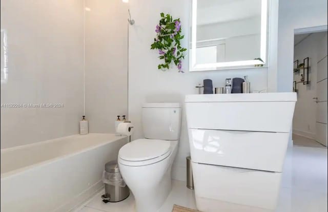 bathroom with tile patterned flooring and toilet