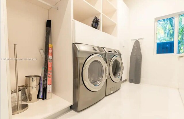 laundry room with laundry area and washer and clothes dryer