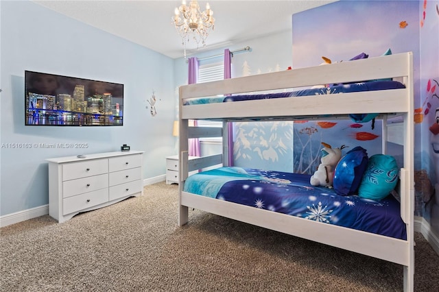 bedroom featuring carpet floors and a notable chandelier