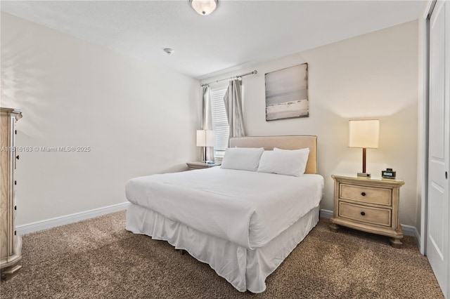 bedroom featuring dark carpet