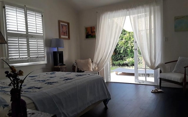 bedroom featuring access to outside and dark wood-type flooring