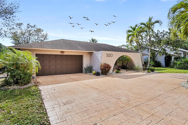 ranch-style house featuring a garage