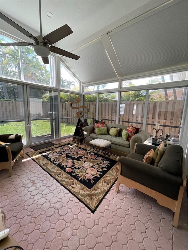 sunroom / solarium with vaulted ceiling, ceiling fan, and a wealth of natural light