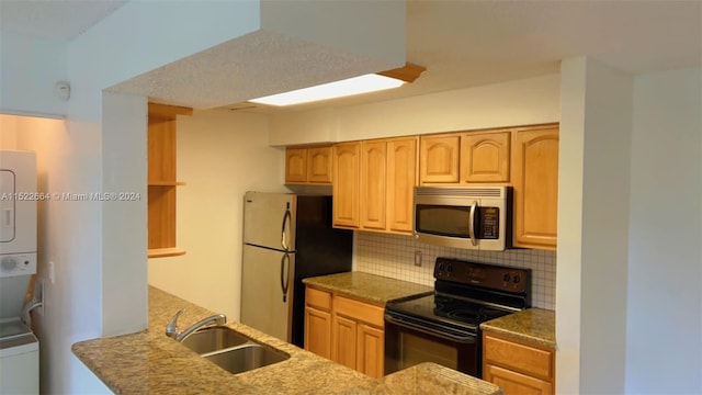 kitchen with backsplash, stainless steel appliances, and sink