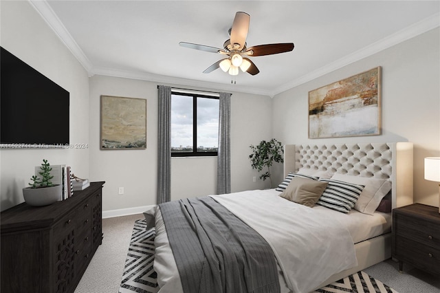 carpeted bedroom featuring ceiling fan and ornamental molding