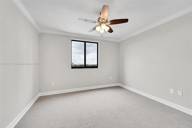 unfurnished room featuring carpet, ceiling fan, and ornamental molding