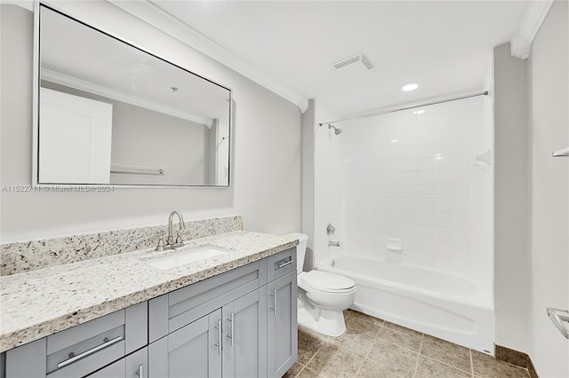 full bathroom featuring vanity, toilet, tiled shower / bath, and ornamental molding