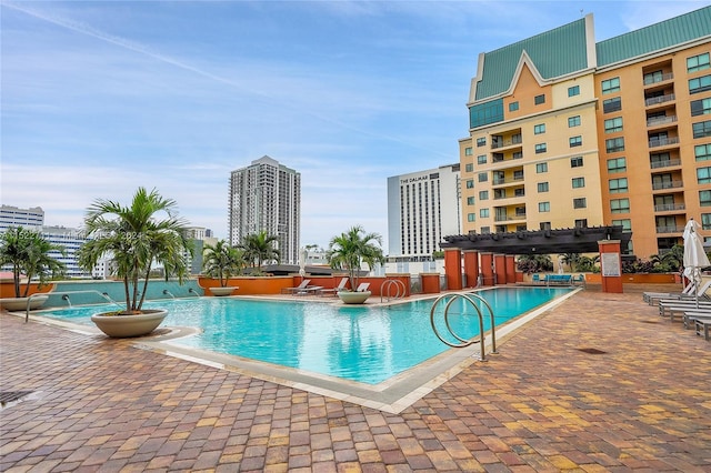 view of pool featuring a pergola and a patio