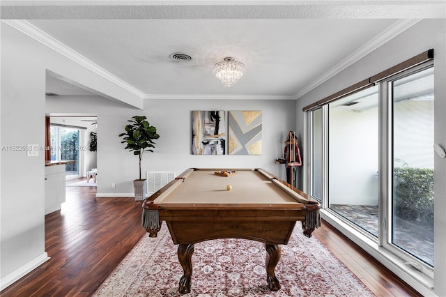 game room with dark wood-type flooring, an inviting chandelier, ornamental molding, and pool table