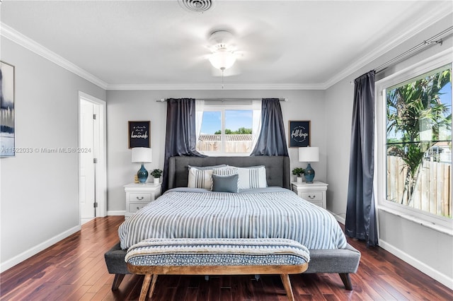 bedroom with crown molding, ceiling fan, and dark hardwood / wood-style flooring